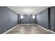 Spacious basement features recessed lighting, stylish flooring, and natural light from windows at 1768 Hood Rd, Dacula, GA 30019