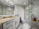 Modern bathroom featuring a glass shower, marble countertops, and great natural light at 1768 Hood Rd, Dacula, GA 30019