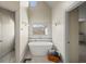 Bathroom with a freestanding tub under an octagon window and modern fixtures offering a spa-like experience at 1768 Hood Rd, Dacula, GA 30019