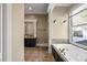 Relaxing bathroom with a soaking tub, separate shower, and elegant finishes at 1768 Hood Rd, Dacula, GA 30019