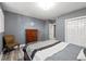 Comfortable bedroom featuring a queen-sized bed, modern décor, and a closet at 1768 Hood Rd, Dacula, GA 30019