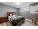 Comfortable bedroom featuring a queen-sized bed, modern décor, and a side-table at 1768 Hood Rd, Dacula, GA 30019