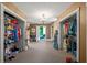Spacious walk-in closets providing ample storage with built-in shelving and rods for organized clothing and accessories at 1768 Hood Rd, Dacula, GA 30019