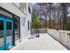 Spacious deck with outdoor seating overlooking lush greenery, perfect for relaxing or entertaining at 1768 Hood Rd, Dacula, GA 30019