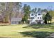 Stunning two-story home with a large front yard and three-car garage provides ample parking at 1768 Hood Rd, Dacula, GA 30019