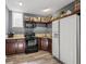 Efficient kitchen features stainless steel appliances, wood cabinets, granite counters, and decor shelving at 1768 Hood Rd, Dacula, GA 30019