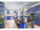 Spacious kitchen features custom blue cabinets, a large island, and stainless steel appliances at 1768 Hood Rd, Dacula, GA 30019