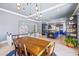 Open kitchen and dining area with a built-in island fireplace at 1768 Hood Rd, Dacula, GA 30019