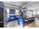 Spacious kitchen with a large island, stainless steel appliances, and eye-catching blue cabinetry at 1768 Hood Rd, Dacula, GA 30019