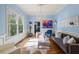 Elegant living room with hardwood floors, a chandelier, and wainscoting at 1768 Hood Rd, Dacula, GA 30019