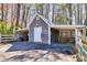 Charming shed with carport offers storage and workspace, perfect for hobbies or projects at 1768 Hood Rd, Dacula, GA 30019