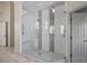 Large walk-in shower featuring white subway tile and a built-in bench for comfort and convenience at 1768 Hood Rd, Dacula, GA 30019