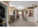Spacious walk-in closet with built-in shelving and a chandelier adding a touch of elegance at 1768 Hood Rd, Dacula, GA 30019