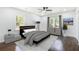 Bright bedroom with a modern ceiling fan, wood floors, and stylish furnishings at 1863 Bruce Ne Rd, Atlanta, GA 30329
