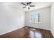 Bedroom with hardwood floors, ceiling fan, and a large window at 1863 Bruce Ne Rd, Atlanta, GA 30329