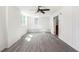 Bright bonus room featuring modern flooring, wainscoting, and natural light at 1863 Bruce Ne Rd, Atlanta, GA 30329