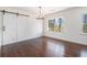 Dining room with a sliding barn door, modern chandelier, and large windows at 1863 Bruce Ne Rd, Atlanta, GA 30329