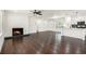 Spacious living room with fireplace, hardwood floors, and access to the kitchen at 1863 Bruce Ne Rd, Atlanta, GA 30329