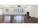 Large living room with hardwood floors, fireplace, and a view of the surrounding woods at 1863 Bruce Ne Rd, Atlanta, GA 30329