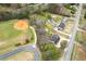 Home with outbuilding and ball field in the background as seen from an aerial view at 2285 Bascomb Carmel Rd, Woodstock, GA 30189