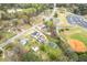 Aerial view of neighborhood including multiple homes with inground pools and driveways at 2285 Bascomb Carmel Rd, Woodstock, GA 30189