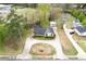 Aerial view of home featuring large circular driveway, outbuilding, and green surroundings at 2285 Bascomb Carmel Rd, Woodstock, GA 30189