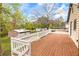 Expansive wooden deck offers a great space for outdoor entertaining and dining at 2285 Bascomb Carmel Rd, Woodstock, GA 30189