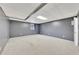 Large unfinished basement with a window, door and painted gray walls at 2285 Bascomb Carmel Rd, Woodstock, GA 30189