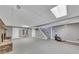 Unfinished basement with brick fireplace and access to stairwell at 2285 Bascomb Carmel Rd, Woodstock, GA 30189