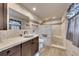 Updated bathroom featuring white tile walls, dark wood cabinets, and a walk-in shower at 2285 Bascomb Carmel Rd, Woodstock, GA 30189