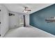 Comfortable bedroom with ceiling fan, window, and nice accent wall paint at 2285 Bascomb Carmel Rd, Woodstock, GA 30189