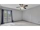 Bedroom with neutral paint, carpet, ceiling fan, and French doors leading to a deck at 2285 Bascomb Carmel Rd, Woodstock, GA 30189