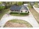 Aerial view of the home with a circular driveway and manicured landscaping at 2285 Bascomb Carmel Rd, Woodstock, GA 30189