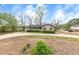 A well-kept front yard and charming exterior create a welcoming curb appeal at 2285 Bascomb Carmel Rd, Woodstock, GA 30189