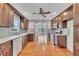 Updated kitchen featuring stainless steel appliances, dark wood cabinets, and granite countertops at 2285 Bascomb Carmel Rd, Woodstock, GA 30189