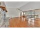 Spacious living room with hardwood floors, brick fireplace and natural light at 2285 Bascomb Carmel Rd, Woodstock, GA 30189