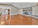 Bright and airy living room features hardwood flooring and a beautiful brick fireplace at 2285 Bascomb Carmel Rd, Woodstock, GA 30189