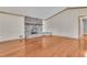 Open-concept living room showcasing hardwood floors and cozy fireplace at 2285 Bascomb Carmel Rd, Woodstock, GA 30189
