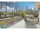View of spacious back deck with table and chairs overlooking expansive, wooded backyard at 3272 Creek E Trce, Powder Springs, GA 30127