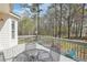 The outdoor back deck has seating with table with beautiful natural surroundings at 3272 Creek E Trce, Powder Springs, GA 30127