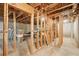 Unfinished basement with exposed wooden frames, a concrete floor, and utilities awaiting completion at 3272 Creek E Trce, Powder Springs, GA 30127