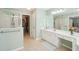 The bathroom shows a walk in shower, plenty of counter space, and access to a walk-in closet at 3272 Creek E Trce, Powder Springs, GA 30127