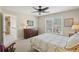 Bright bedroom features a ceiling fan and a window with outside view and a decorative bedspread at 3272 Creek E Trce, Powder Springs, GA 30127