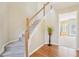 The foyer features a staircase with wood and white trim and hardwood flooring at 3272 Creek E Trce, Powder Springs, GA 30127
