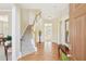 Bright foyer with hardwood floors, staircase, and views through to the back of the house at 3272 Creek E Trce, Powder Springs, GA 30127