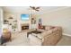 Cozy living room with built-in bookshelves, brick fireplace, and neutral-toned furnishings at 3272 Creek E Trce, Powder Springs, GA 30127