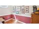 Small office with gallery wall, wainscoting, and hardwood floors shows a space for creative pursuits at 3272 Creek E Trce, Powder Springs, GA 30127