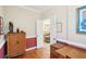 Office with hardwood floors, natural-toned walls, and view to the living room shows great space and light at 3272 Creek E Trce, Powder Springs, GA 30127