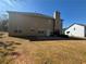 Large backyard and home exterior with patio and ample green space at 5761 Harrier Ln, Atlanta, GA 30349