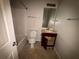 Bathroom features combination tub and shower with sink at 5761 Harrier Ln, Atlanta, GA 30349